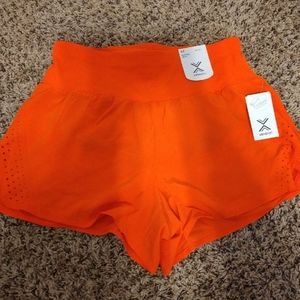 Bright orange athletic shorts